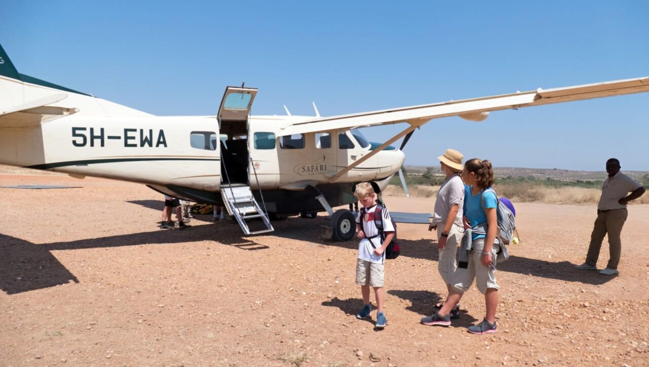 Family with Children Arriving at Airstrip Next to Cessna 208 B Grand Caravan